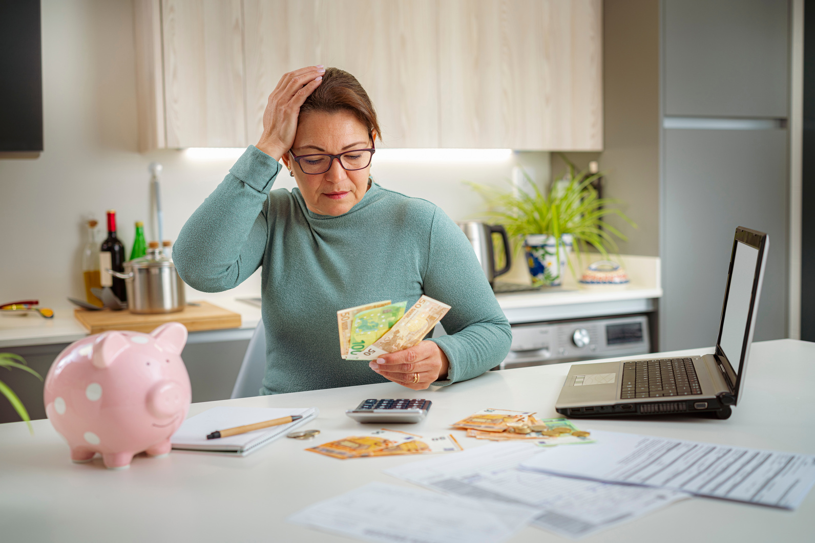 Woman worried about cost of living counting money